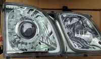 Фары (оптика) Lexus LX470 1998-2007 линза + ангельские глазки (зеленый оттенок)
