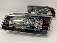 Фары (оптика) черные Toyota Sprinter Carib AE100 AE110
