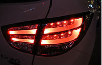 Стопы (фары) «BMW Design» для Hyundai Tucson Ix35 (прозрачные, красные)