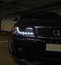 Передние альтернативные тюнинг фары на Audi A6 #2